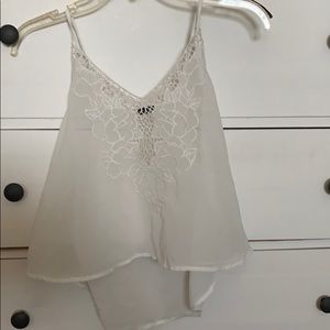 Flowy white top with floral pattern